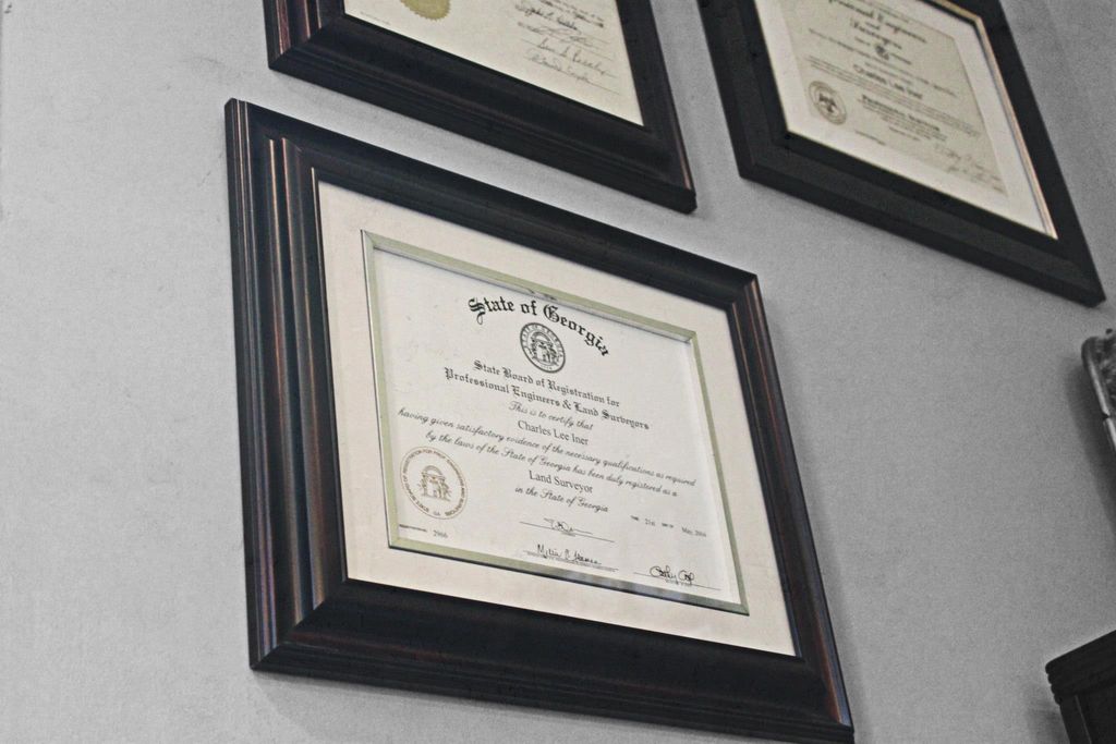 Several of Charles' surveying licenses.
