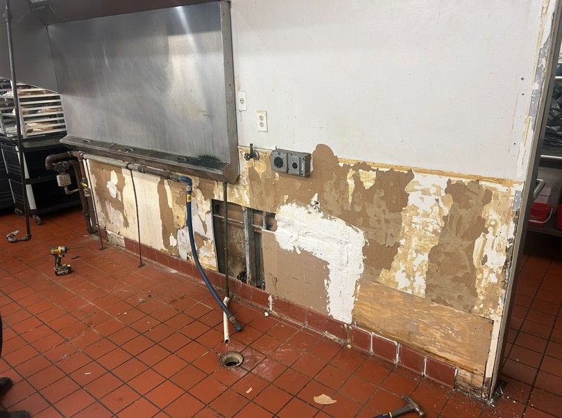Old, damaged wall causing code violation