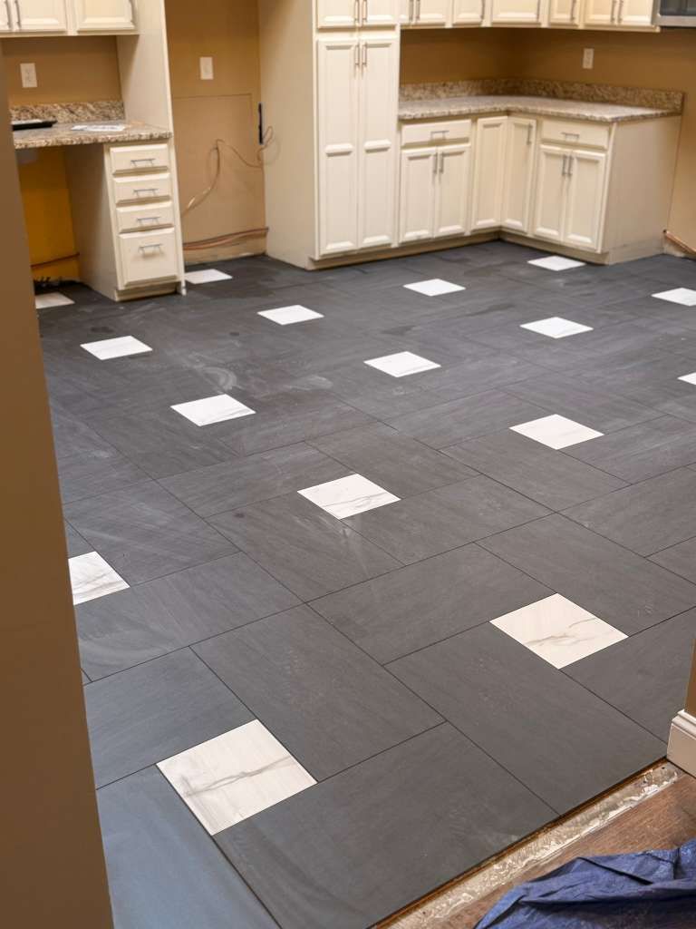Large format porcelain floor installation with mod