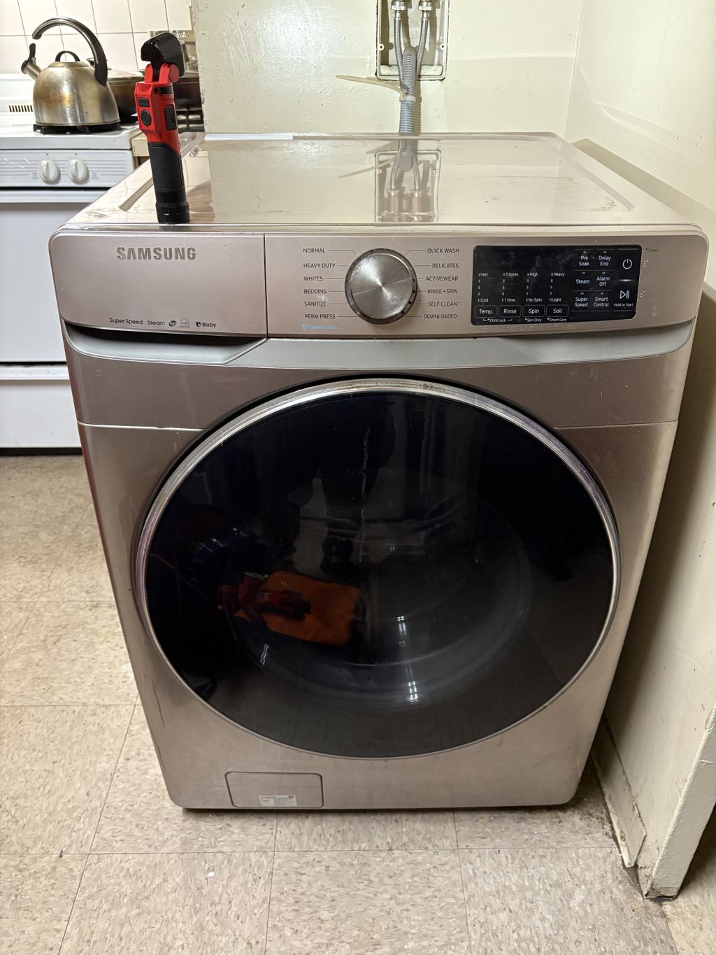 The Samsung washer unbalanced and UE error code. T