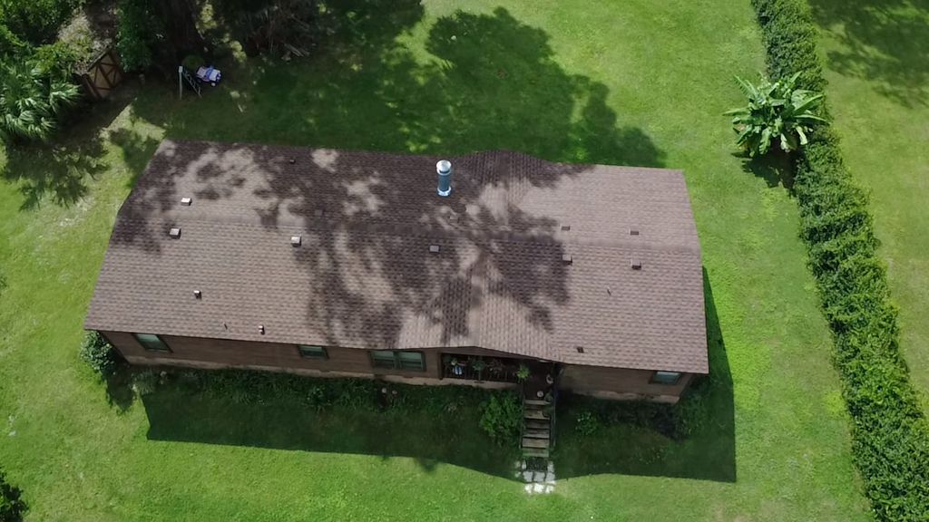 Double-wide mobile home roof replacement that comp