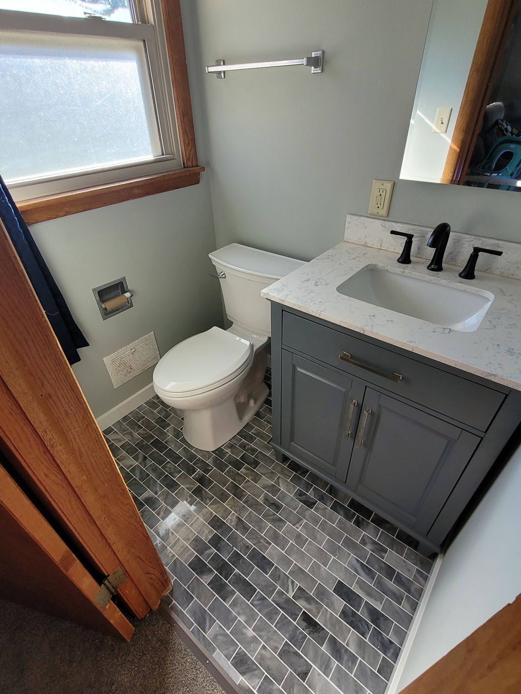 installed the tile flooring, new baseboard trim, a
