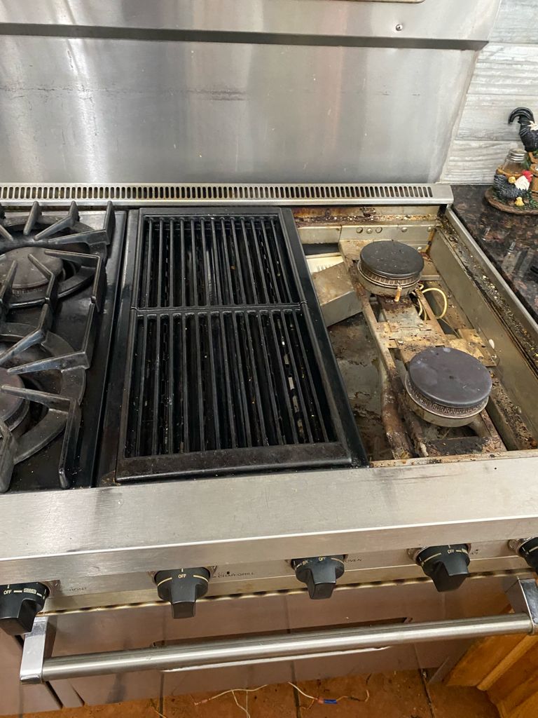 Viking stove had gas smell and clicking burners. W