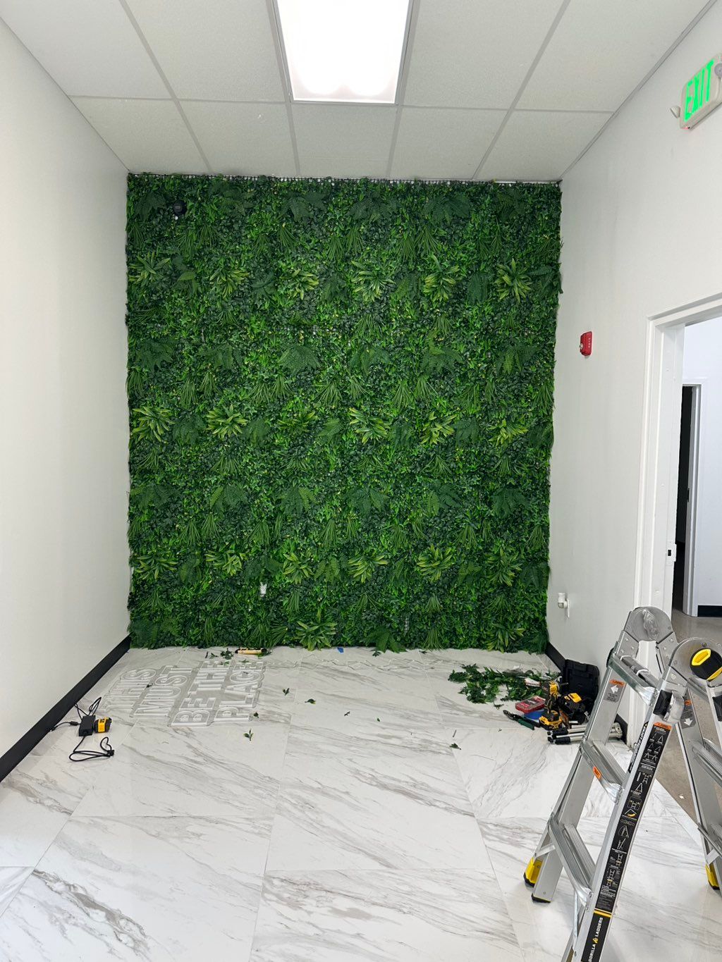 Installed a full artificial greenery wall for a co