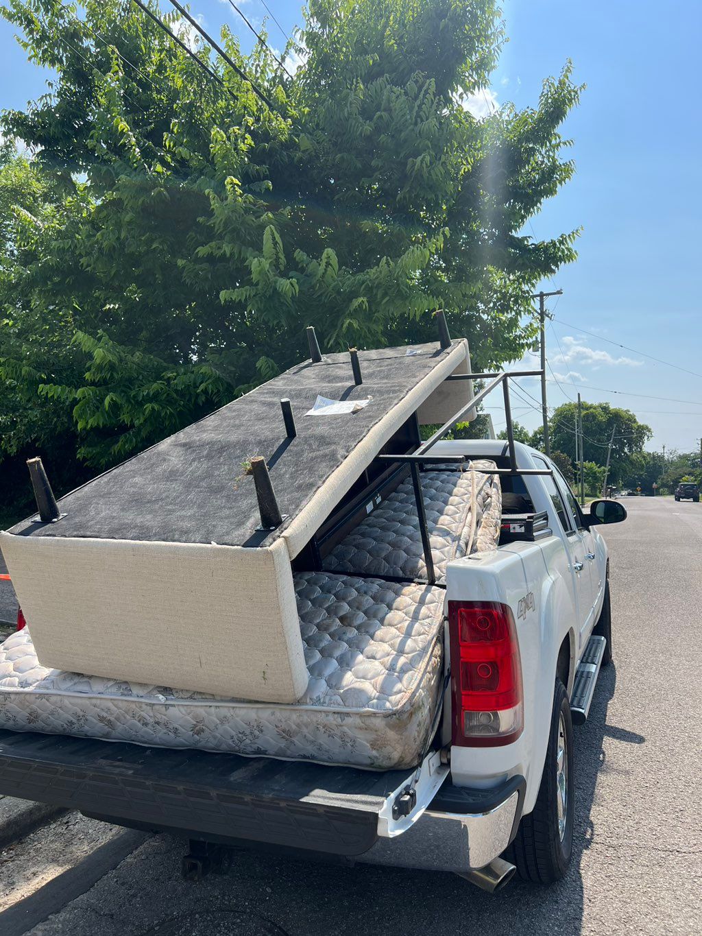 Mattress, couch, and other odds and ends placed in